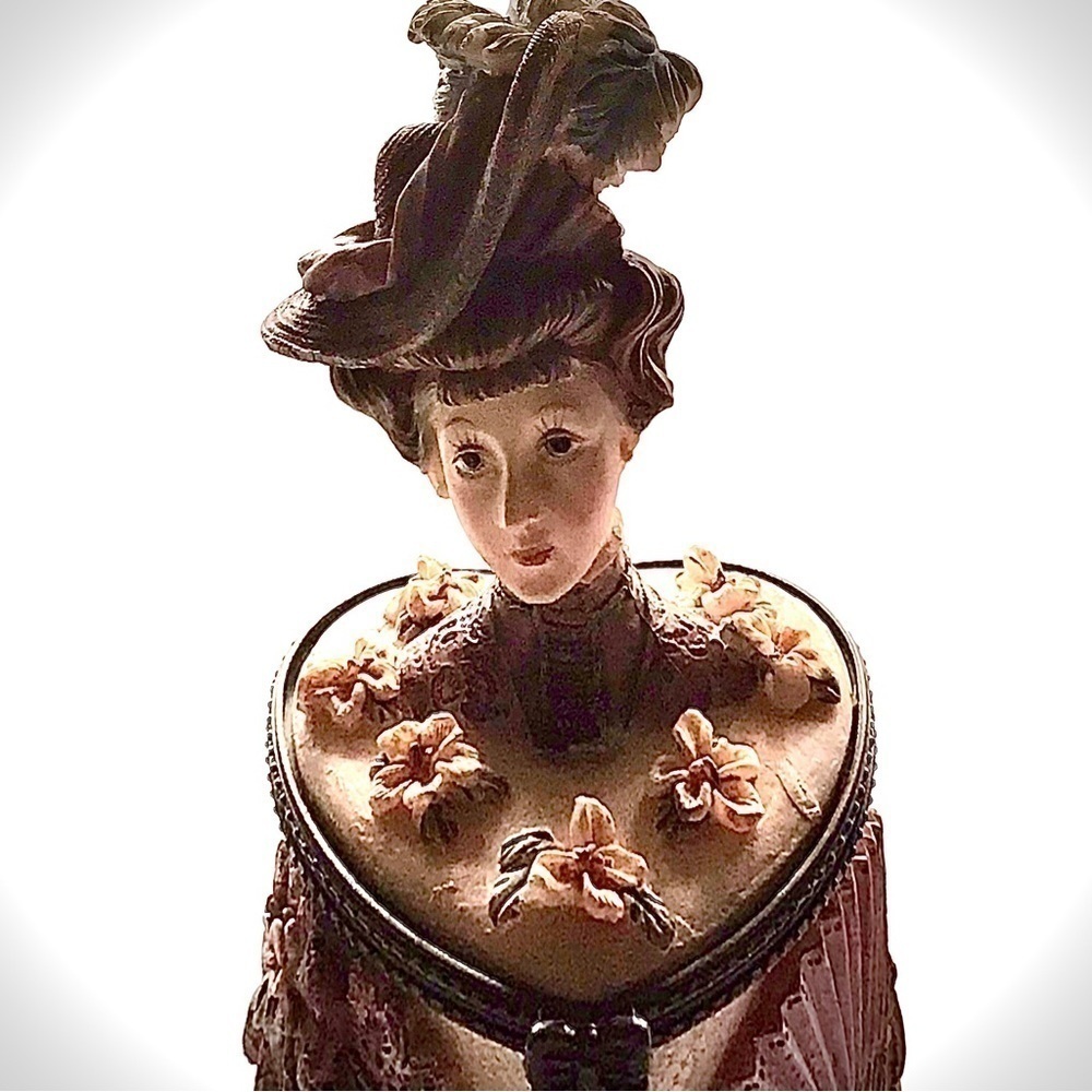 Vintage Old Fashioned Victorian Lady on top of a heart shaped trinket/ring box